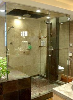 a bathroom with a walk in shower next to a sink