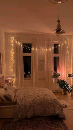 a bedroom decorated with lights and fairy lights