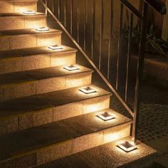 stairs lit up with lights at night