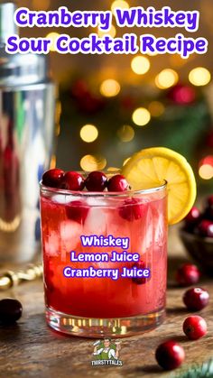 cranberry whiskey sour cocktail recipe in a glass with lemon and cranberries