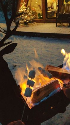 an open fire pit with marshmallows on it