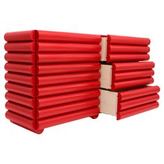 a stack of red plastic tubes sitting on top of each other