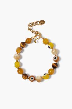 A playful take on the traditional evil eye. A bracelet of yellow jade, tigers eye, natural mop, and yellow and orange glass evil eye beads is finished with an 18k gold plated sterling silver hook. Layer with more gold bracelets for an added pop of color. 18k gold plated sterling silver. 6 1/2 - 8" adjustable. Handmade in Vietnam. Eye Natural, Crystal Bead Jewelry, Glass Evil Eye, Evil Eye Beads, Yellow Jade, Tiger Eye Bracelet, Handmade Box, Gold Bracelets, Eye Beads