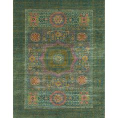 a green rug with an intricate design on the top and bottom, in different colors