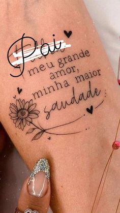 a woman's leg with a tattoo saying poi meu grande, amo, minima mair sudade