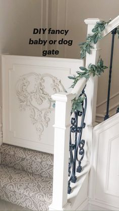 the stairs are decorated with greenery and wrought iron railings