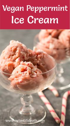 two glasses filled with ice cream next to candy canes