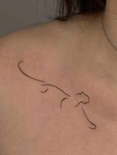 a woman with a tattoo on her chest