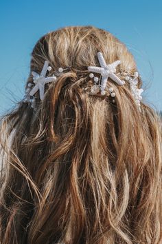 the back of a woman's head with starfish hair pins