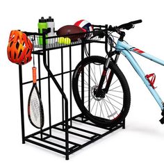 there is a bike that is attached to a rack with sports equipment on the top