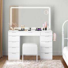 a bedroom with a vanity, stool and mirror on the wall in front of it