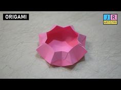 an origami bowl sitting on top of a table