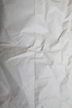 a piece of white paper that has been wrinkled