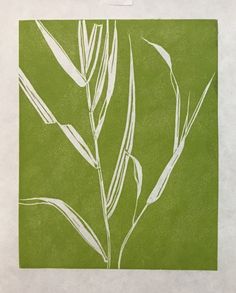 a green and white print with leaves on it