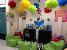 the cat in the hat themed classroom is decorated with pom poms and chairs