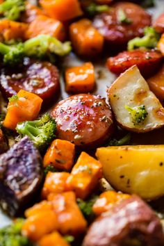 a close up view of potatoes, broccoli and carrots