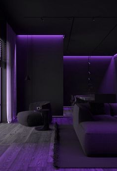 a living room filled with furniture and purple lighting