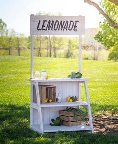 a lemonade stand in the middle of a field