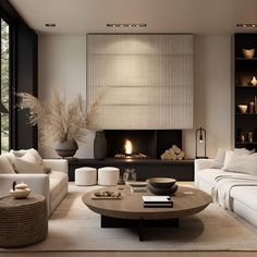 a living room with white furniture and a fire place