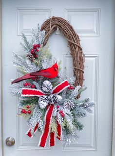 a christmas wreath with a cardinal on it