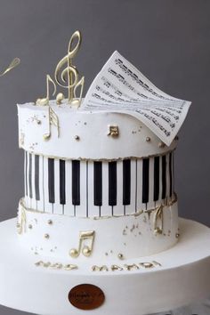 a cake decorated with music notes and piano keys