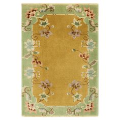 an area rug with flowers and leaves on it in green, yellow and beige colors