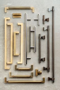 several different types of handles and pulls on a wall