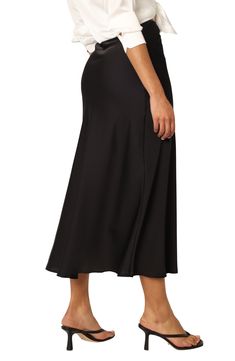 Smooth satin adds to the elegance of a beautifully draped skirt designed for a perfect fit with an elastic waist. Elastic waist 97% polyester, 3% spandex Hand wash, dry flat Imported Elegant Black Ruched Maxi Skirt, Summer Midi Skirt In Elastane, Summer Midi Elastane Skirt, Rayon Midi Pleated Skirt, Rayon Pleated Midi Skirt, Elegant Black Ruched Bottoms, Elegant Black Draped Pencil Skirt, Sleek Lined Flared Skirt, Sleek Asymmetrical Lined Skirt