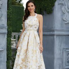 Elevate your style with the Eliza Ballgown Dress. This elegant gown boasts a long train fit for a princess, making you feel like royalty. Perfect for formal events, this dress is sure to turn heads and make a statement.