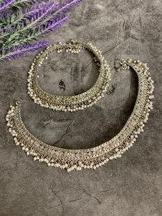 Bridal Antique payal set (pair). Brass made very flexible . Clear reverse polki and bell . About 9 inch long each and 4.5 inch closed. Traditional Silver Beaded Anklets For Festive Occasions, Traditional Silver Anklets For Festive Occasions, Festive Silver Temple Jewelry Anklets, Silver Temple Jewelry Anklets For Festive Occasions, Festive Silver Oxidized Anklets, Festive Silver Anklets With Oxidized Finish, Traditional Oxidized Wedding Anklets, Traditional Oxidized Anklets For Wedding, Traditional Silver Beaded Wedding Anklets