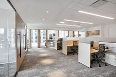 an empty office with cubicles and desks