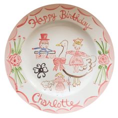 a pink and white plate with an image of two children on it