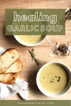 two bowls of garlic soup with bread on the side and herbs in the bowl next to it