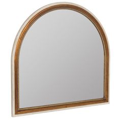 an arch shaped mirror with gold trimmings on the sides and a white background