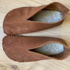 the inside of a pair of brown leather shoes