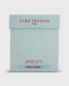 an envelope with the words cire trudon on it and red lettering in black