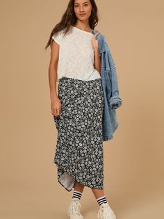 This midi skirt features a beautiful floral print and an elastic back waistband for a comfortable, perfect fit. Ideal for both casual outings and dressier occasions, this skirt effortlessly combines style and comfort. Midi Skirt With Sneakers, Skirt With Sneakers, Skirts With Sneakers, Floral Midi Skirt, Sweater Sale, Altar'd State, Bottom Clothes, Summer Collection, Clothes For Sale