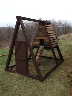 a chicken coop made out of wood and metal