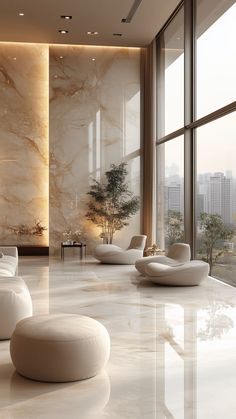 a living room filled with white furniture next to large windows and floor to ceiling windows