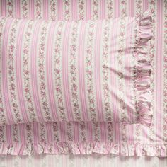 pink and white striped bedding with ruffled edges