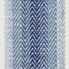 an abstract blue and white pattern on fabric