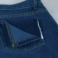 a pair of blue jeans with white stitching