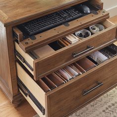 a computer desk with drawers and a keyboard