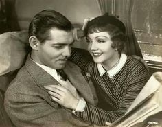 an old black and white photo of two people