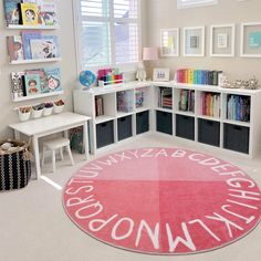 a child's playroom with bookshelves and toys