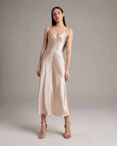 This elegant bias-cut slip dress features a spaghetti strap and flattering V Neck for a fresh, yet refined look. This perfect basic can be worn for life, dressed up, or dressed down, for the perfect effortless ensemble. 100% Silk Charmeuse Made in New York City Product Care: Dry Clean Only Dress Elegantly, Summer Slip Dress, Dress Outer, White Silk Dress, Cami Slip Dress, Bias Cut Dress, Silk Dress Long, Midi Slip Dress, Silk Slip Dress