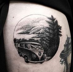 a black and white photo of a vw bus on the thigh