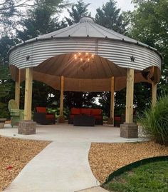 a gazebo sitting in the middle of a park