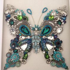 an image of a butterfly made out of beads and jewels on the back of a facebook page