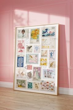 a pink wall with some stamps on it and a wooden floor in front of it